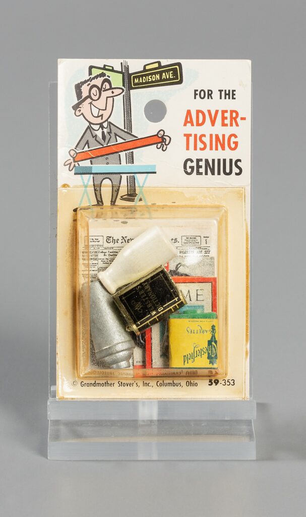 Image of kit that includes a dictionary, cocktail shaker, popular magazine titles, and a bottle of milk from Grandmother Stover’s Fun Miniatures: Advertising, 353, ca. 1965, Gift of Marie E. Stareck. The Strong National Museum of Play, Rochester, New York